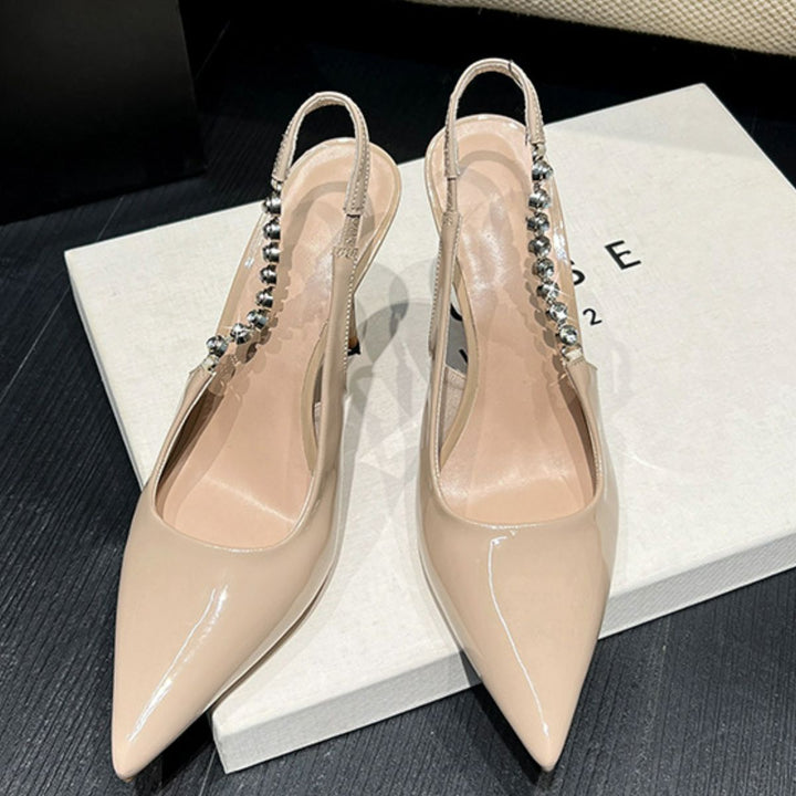 Elegant Point Toe Stiletto Slingback Pumps in patent leather, perfect for any occasion with a high heel design.