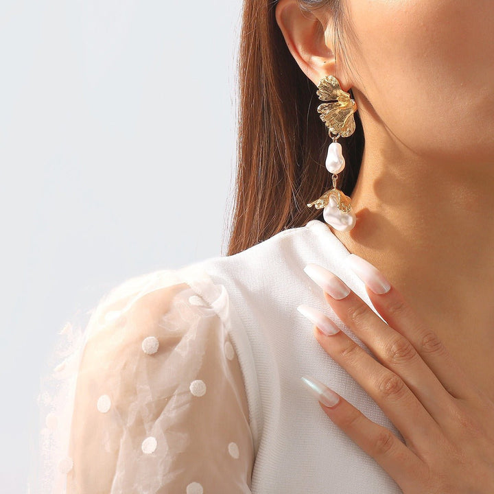 Shaped pearl earrings, metal wind leaves