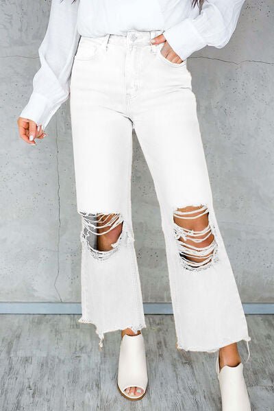 Chic Distressed Denim Jeans with Trendy Raw Hem and Practical Pockets